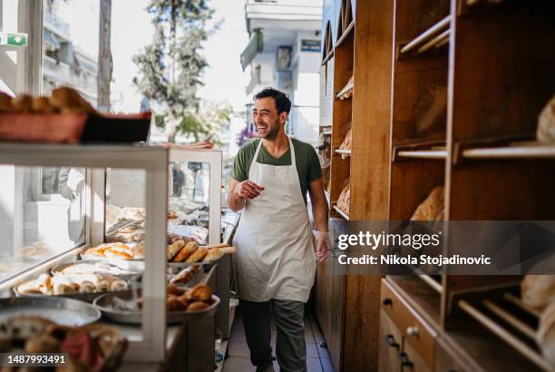 baker sorting bread - artisanal stock pictures, royalty-free photos & images