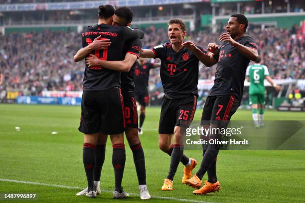 Leroy Sane of FC Bayern Munich celebrates with team mates after scoring their sides second goal during the Bundesliga match between SV Werder Bremen...
