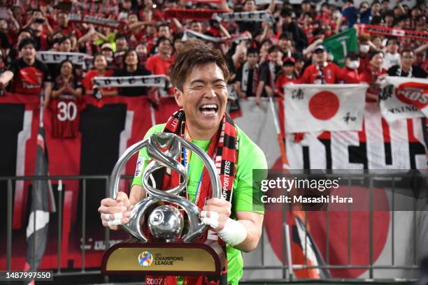 Shusaku Nishikawa of Urawa Reds holds the trophy after the AFC Champions League final second leg between Urawa Red Diamonds and Al-Hilal at Saitama...