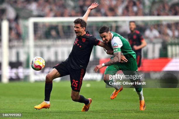 Thomas Mueller of FC Bayern Munich is challenged by Marco Friedl of SV Werder Bremen during the Bundesliga match between SV Werder Bremen and FC...