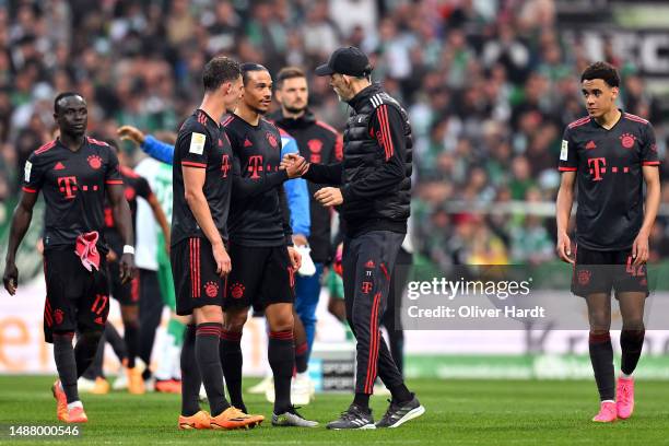Thomas Tuchel, Head Coach of FC Bayern Munich, interacts with Leroy Sane of FC Bayern Munich after the Bundesliga match between SV Werder Bremen and...