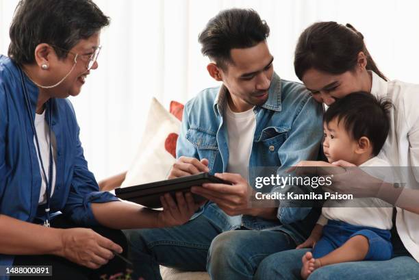 senior woman real estate sales agent staff introducing and explain house facility and function to young asian couple customer when visit location before move to new house . real estate business sales agency staff concept. - family decisions stock pictures, royalty-free photos & images