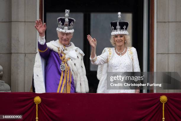 King Charles III and Queen Camilla are seen on the Buckingham Palace balcony during the flypast during the Coronation of King Charles III and Queen...