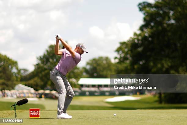 Wyndham Clark of the United States plays his shot from the eighth tee during the third round of the Wells Fargo Championship at Quail Hollow Country...