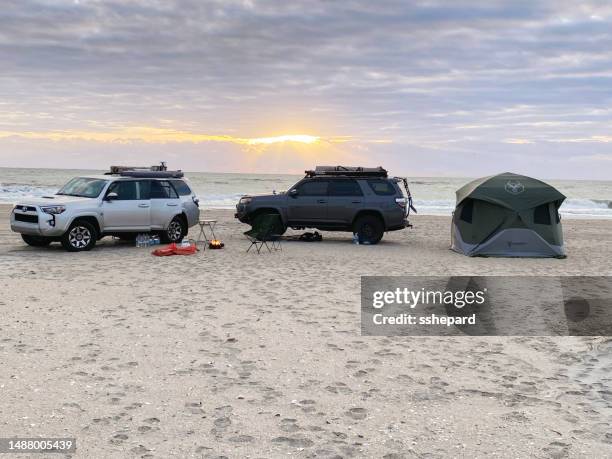 overland camping on the beach with 4runners at sunrise - cape lookout national seashore stock pictures, royalty-free photos & images