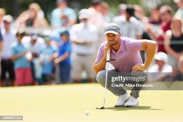 Wyndham Clark of the United States lines up a putt on the ninth green during the third round of the Wells Fargo Championship at Quail Hollow Country...