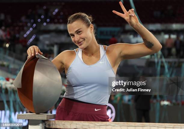 Aryna Sabalenka celebrates with the trophy after defeating Iga Swiatek of Poland during the women's final match on Day Thirteen of the Mutua Madrid...