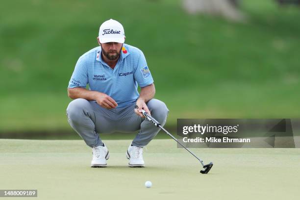 Cameron Young of the United States lines up a putt on the 14th green during the third round of the Wells Fargo Championship at Quail Hollow Country...