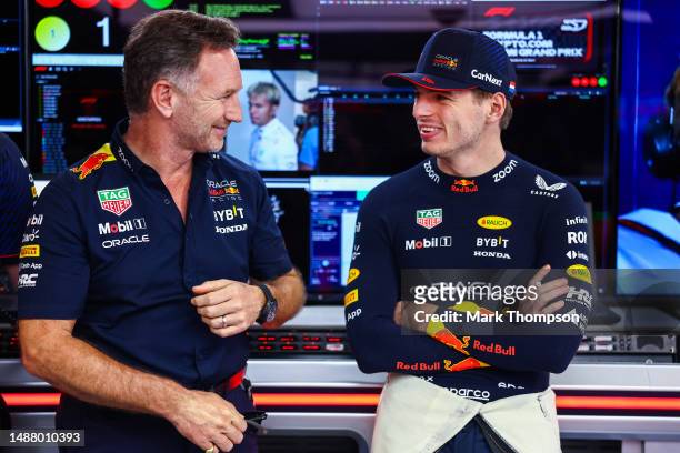 Max Verstappen of the Netherlands and Oracle Red Bull Racing talks with Red Bull Racing Team Principal Christian Horner in the garage during...