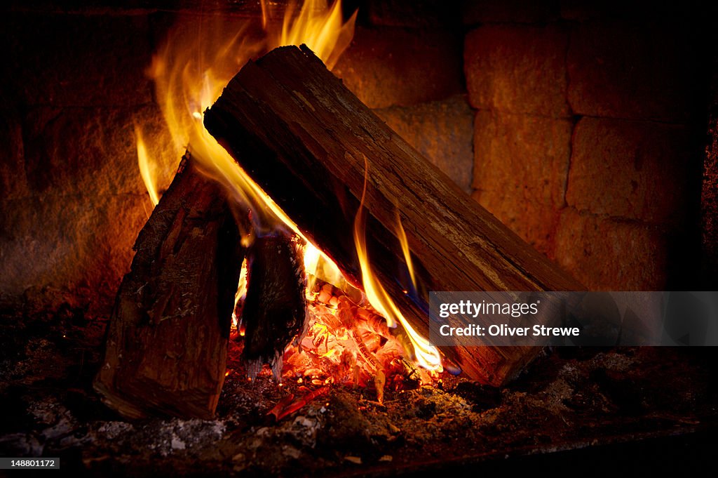 Logs in an open fire.