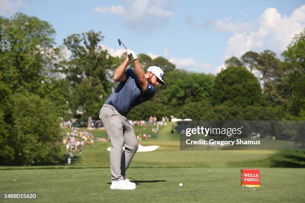 Tyrrell Hatton of England plays his shot from the 13th tee during the third round of the Wells Fargo Championship at Quail Hollow Country Club on May...