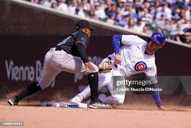 Cody Bellinger of the Chicago Cubs steals second against Xavier Edwards of the Miami Marlins during the eighth inning of a game at Wrigley Field on...