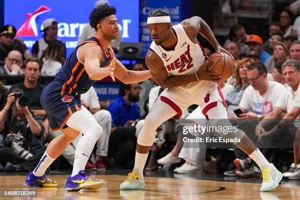 Quentin Grimes of the New York Knicks defends Jimmy Butler of the Miami Heat during game three of the Eastern Conference Semifinals at Kaseya Center...