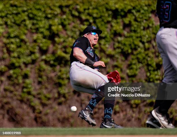 Peyton Burdick of the Miami Marlins is unable to catch the double by Trey Mancini of the Chicago Cubs during the eighth inning of a game at Wrigley...
