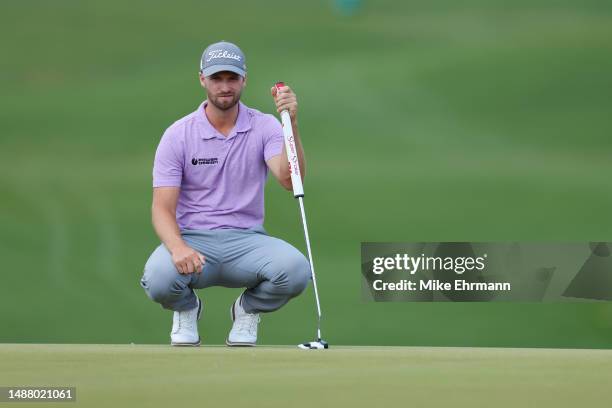 Wyndham Clark of the United States lines up a putt on the 16th green during the third round of the Wells Fargo Championship at Quail Hollow Country...