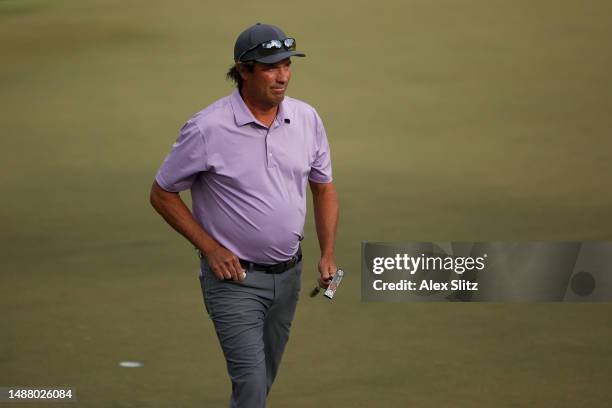 Stephen Ames of Canada walks off of the 18th green after completing his round during the second round of the Mitsubishi Electric Classic at TPC...