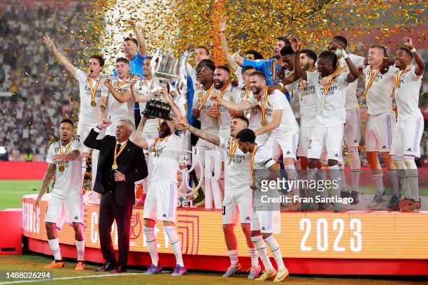 Karim Benzema of Real Madrid lifts the Copa del Rey trophy after their side's victory in the Copa del Rey Final match between Real Madrid and CA...