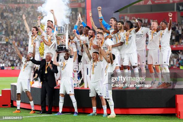 Karim Benzema of Real Madrid lifts the Copa del Rey trophy after their side's victory in the Copa del Rey Final match between Real Madrid and CA...