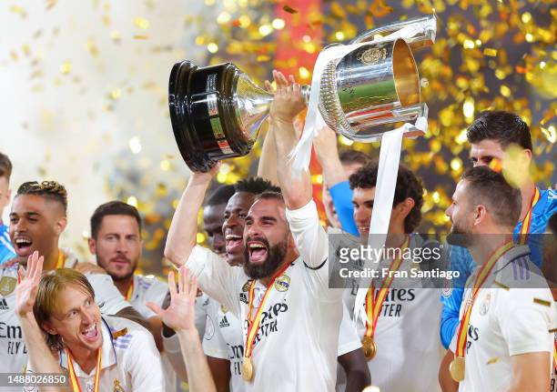 Daniel Carvajal of Real Madrid lifts the Copa del Rey trophy after their side's victory in the Copa del Rey Final match between Real Madrid and CA...