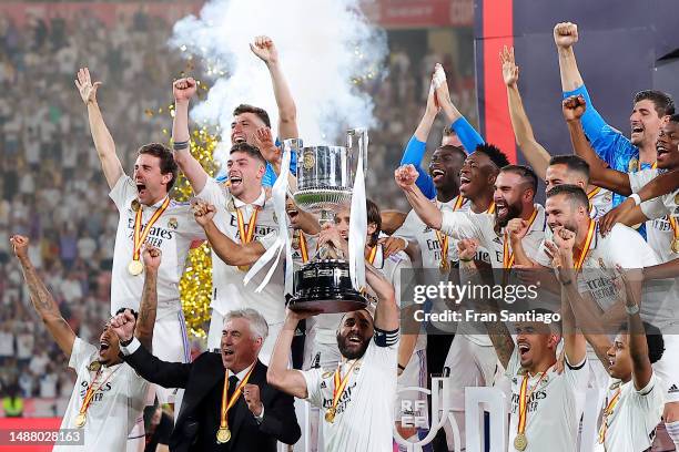 Karim Benzema of Real Madrid lifts the Copa del Rey trophy after their side's victory in the Copa del Rey Final match between Real Madrid and CA...