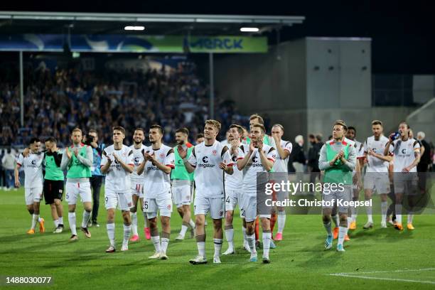 The team of FC St. Pauli celebrates after winning 3-0 the Second Bundesliga match between SV Darmstadt 98 and FC St. Pauli at Merck-Stadion am...