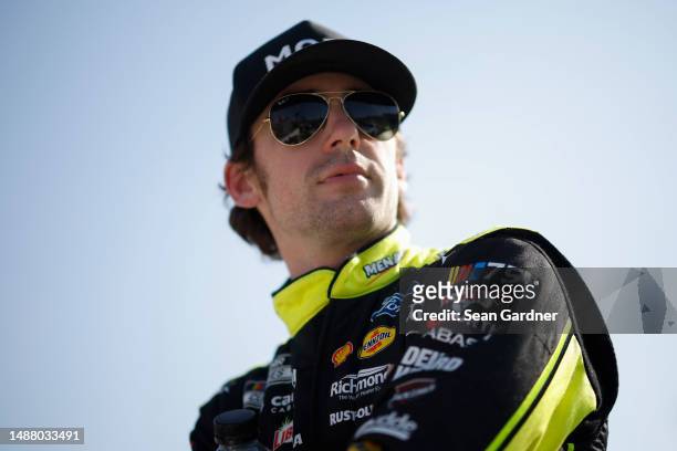 Ryan Blaney, driver of the Menards/Moen Ford, looks on during qualifying for the NASCAR Cup Series Advent Health 400 at Kansas Speedway on May 06,...
