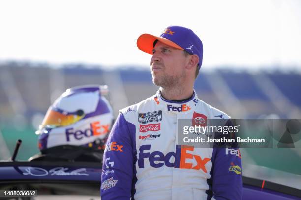 Denny Hamlin, driver of the FedEx Express Toyota, waits on the grid during qualifying for the NASCAR Cup Series Advent Health 400 at Kansas Speedway...