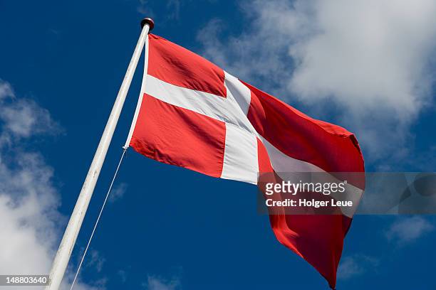 dannebrog danish flag. - danemark stock pictures, royalty-free photos & images