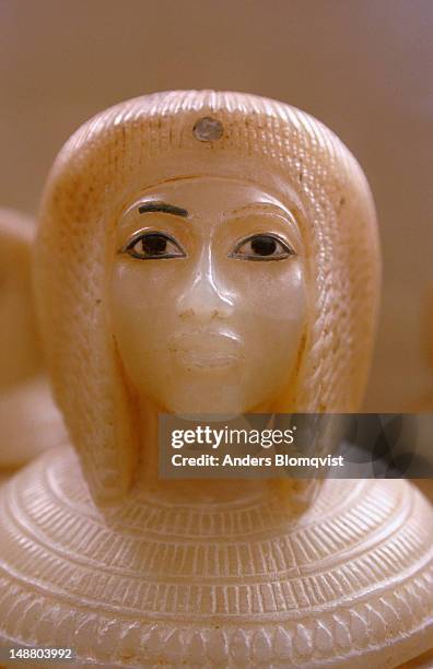 alabaster canopic jar top with detailed female head at the egyptian museum. - alabaster stockfoto's en -beelden