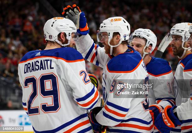 Connor McDavid of the Edmonton Oilers celebrates with Leon Draisaitl after scoring a goal during the second period against the Vegas Golden Knights...