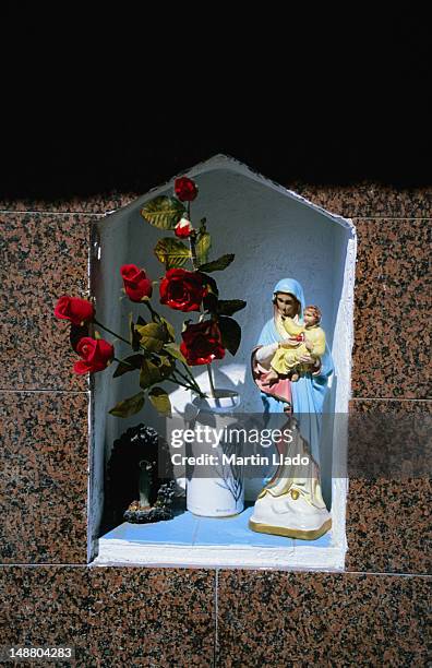 a small shrine set into the wall of a home in giardini naxos. - giardini naxos stock pictures, royalty-free photos & images