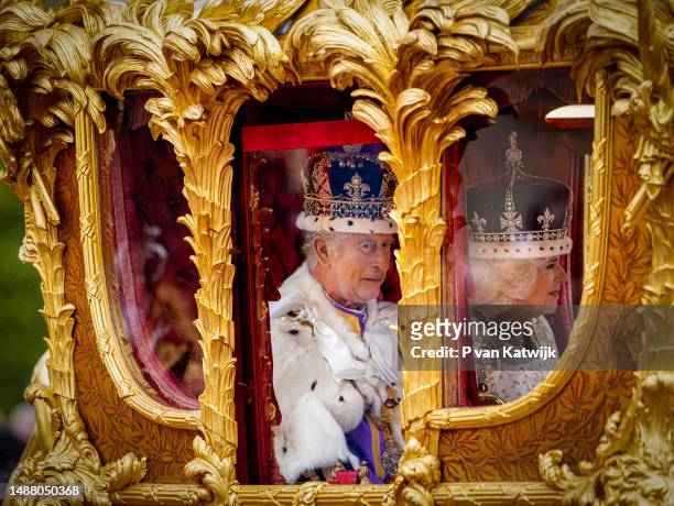King Charles III and Queen Camilla in the Golden State coach during the Coronation of King Charles III and Queen Camilla on May 6, 2023 in London,...