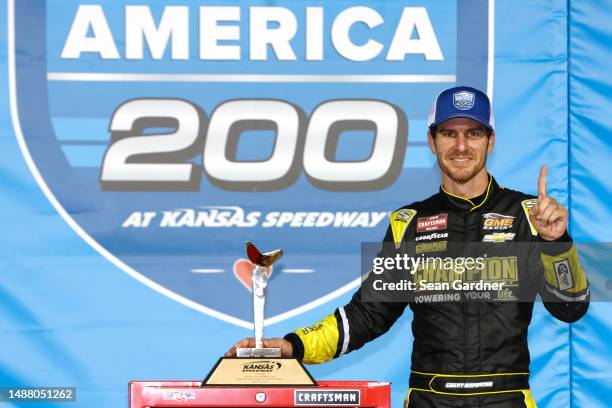 Grant Enfinger, driver of the Chevy Military Appreciation Chevrolet, celebrates in victory lane after winning the NASCAR Craftsman Truck Series Heart...