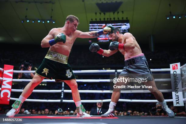 Canelo Alvarez of Mexico punches John Ryder of Great Britain during the fight for the Super Middleweight Championship at Akron Stadium on May 06,...