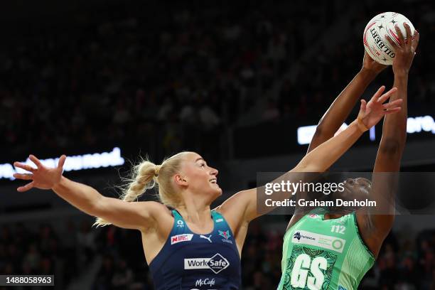 Jhaniele Fowler of the Fever catches the ball under pressure from Jo Weston of the Vixens during the round eight Super Netball match between...
