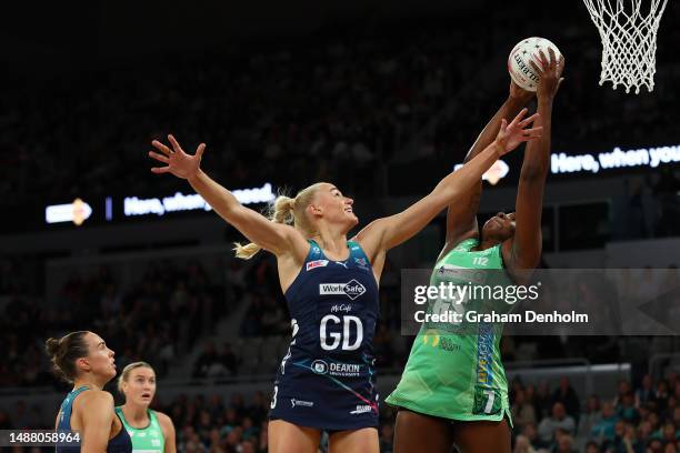 Jhaniele Fowler of the Fever catches the ball under pressure from Jo Weston of the Vixens during the round eight Super Netball match between...