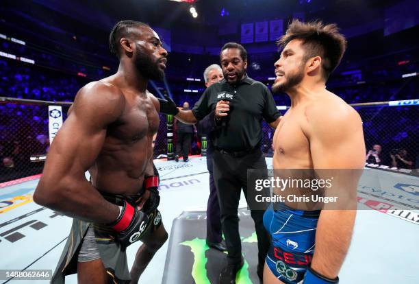 Opponents Aljamain Sterling and Henry Cejudo face off prior to the UFC bantamweight championship fight during the UFC 288 event at Prudential Center...