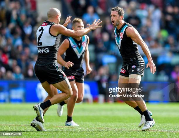 Travis Boak of Port Adelaide celebrates a goal with Sam Powell-Pepper of Port Adelaide during the round eight AFL match between Port Adelaide Power...