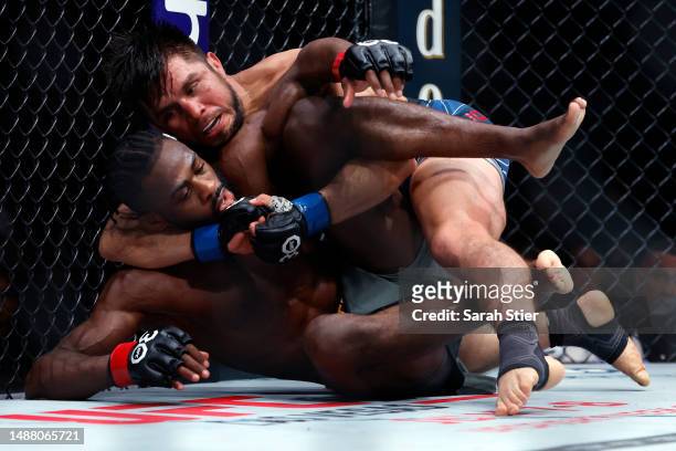 Aljamain Sterling of Jamaica fights against Henry Cejudo during their bantamweight title bout at UFC 288 at Prudential Center on May 06, 2023 in...