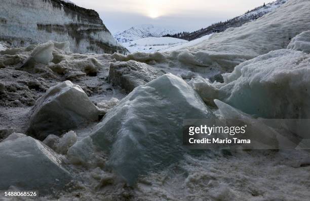 Fallen ice melts in an ice cave created by meltwater at the retreating Castner Glacier in the Alaska Range on May 5, 2023 near Paxson, Alaska. The...