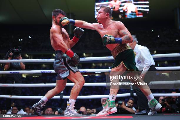 Canelo Alvarez of Mexico punches John Ryder of Great Britain during the fight for the Super Middleweight Championship at Akron Stadium on May 06,...