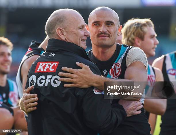 Ken Hinkley coach of Port Adelaide and Sam Powell-Pepper of Port Adelaide celebrate the win after the round eight AFL match between Port Adelaide...