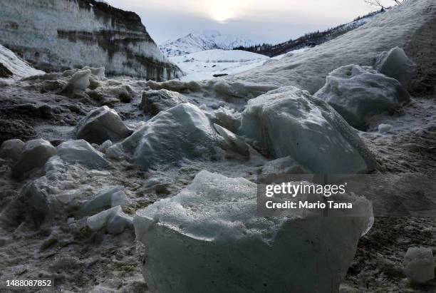 Fallen ice melts in an ice cave created by meltwater at the retreating Castner Glacier in the Alaska Range on May 5, 2023 near Paxson, Alaska. The...