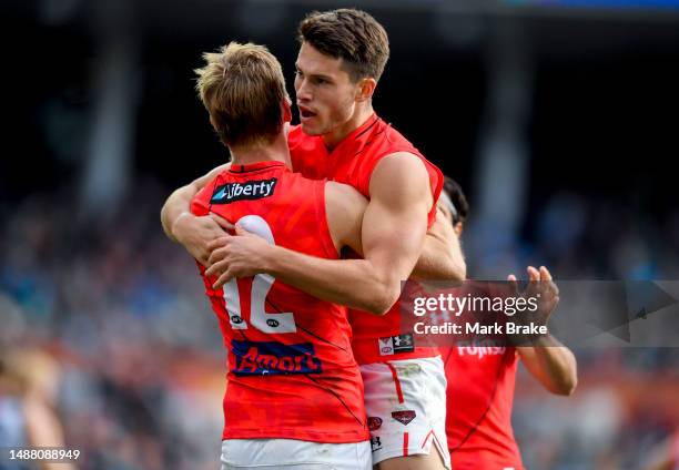 Sam Weideman of the Bombers celebrates a goal with Will Setterfield of the Bombers during the round eight AFL match between Port Adelaide Power and...