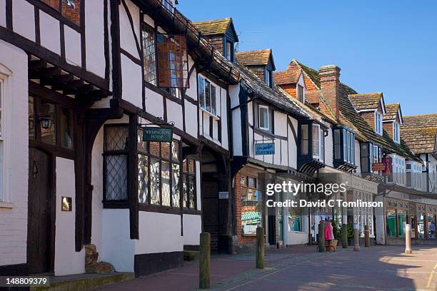 medieval timbered buildings along high street. - east grinstead stock pictures, royalty-free photos & images