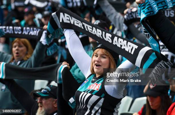 Port supporter sings Never tear us Apart during the round eight AFL match between Port Adelaide Power and Essendon Bombers at Adelaide Oval, on May...
