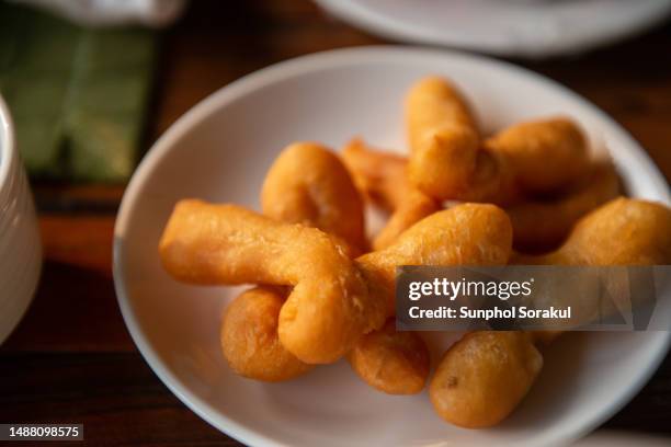 thai breakfast of fried dough - pa tong ko - youtiao stock pictures, royalty-free photos & images
