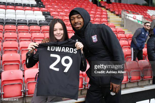Kyle Edwards of Ipswich Town poses for a photo with a fan holding one of his shirts prior to the Sky Bet League One between Fleetwood Town and...