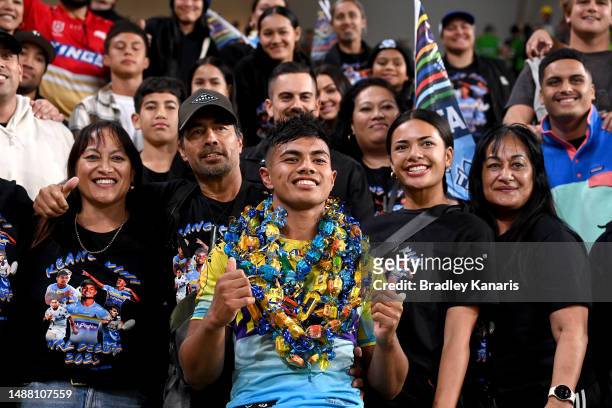 Keano Kini of the Titans celebrates victory with his family members and fans after the round 10 NRL match between Gold Coast Titans and Parramatta...