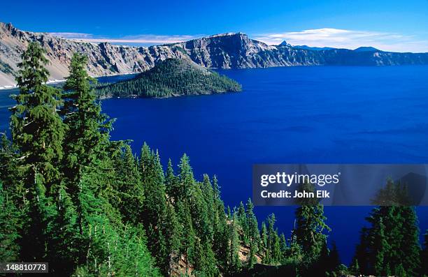 lake and wizard island from crater rim. - crater lake stock pictures, royalty-free photos & images